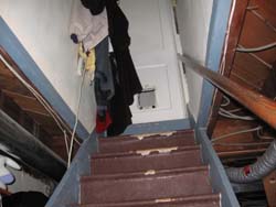 clothes hanging on stairs - trip
							hazard