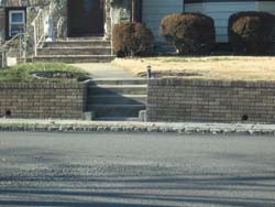 no handrail from steps to street - trip hazard