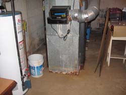 rusted out furnance from
								humidifier leak